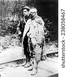 World War I, Another sort of war ruin - after several days in the trenches, a British Red Cross orderly escorting a wounded, captured German soldier to a field hospital 1914-1918.