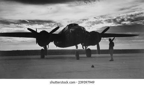 World War II, Soldier Beside WWII Airplane At Sunrise, Circa Early 1940s.