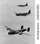 World War II, United States planes in echelon formation, from the top: Boeing Flying Fortress B17, Douglas Transport, Consolidated Liberator B-24, ca 1942.
