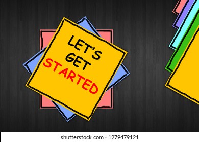 Writing note showing "Lets Get Started". Business photo showcasing beginning time motivational quote Inspiration encourage written on yellow sticky note paper on the wooden background.