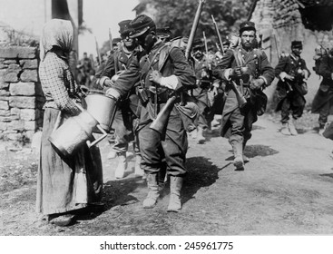 WWI. French Troops On The March, And During The Battle Of The Marne. A Village Women Supplies Them With Drinking Water. Ca. September 6-12, 1914.