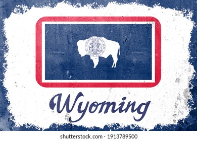 Wyoming state flag vintage road tin sign rusty board. Retro grunge flag of Wyoming decor background.