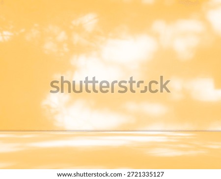Yellow background wall gradient orange color studio room solid podium with shadow leaf on floor, backdrop summer tropical autumn season, stage template platform for presentation product promotion