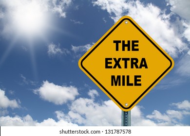 Yellow The Extra Mile Road Sign