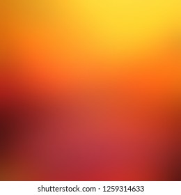 Yellow Orange Red Vivid Blurred Background. Bright Golden Light. Defocus Texture. Abstract Pattern. Ombre Illustration.