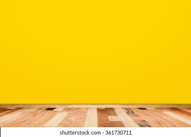 Yellow Room Wall With Wooden Floor Texture.