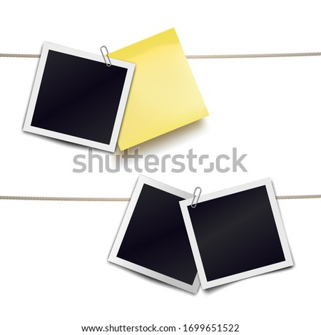 Yellow sticky note and photo frames attached metal paper clips on tapes. Template for design. 