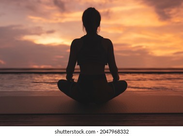 Yoga and meditaion, relaxing in sunset. - 3d rendering - Powered by Shutterstock