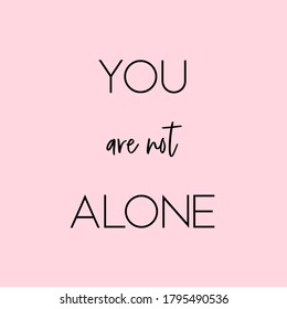 You Are Not Alone. Inspirational Quote. Light Pink Background. Black Script Font And Black Block Font.