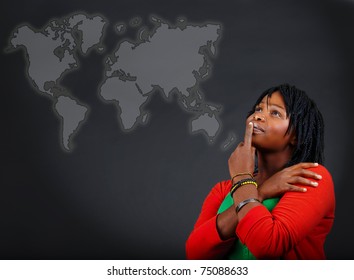 young African American woman thinking and looking at the world map with a positive attitude. - Powered by Shutterstock