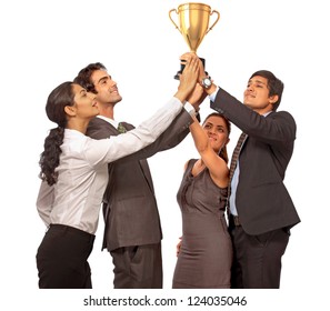 Young Business Team Holding Trophy Showing Success