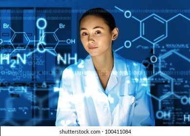 Young chemist in white uniform working in laboratory - Powered by Shutterstock