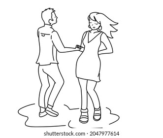 
Young couple enjoying music while dancing salsa or cumbia together.