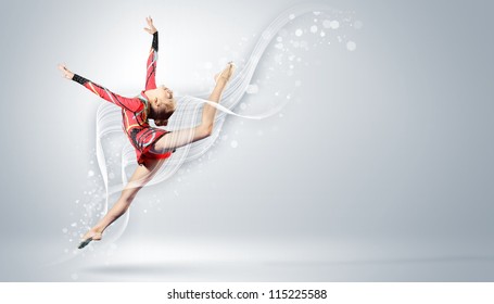 Young Cute Woman In Gymnast Suit Show Athletic Skill On White Background