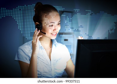 Young woman in business wear in headset working with computer - Powered by Shutterstock