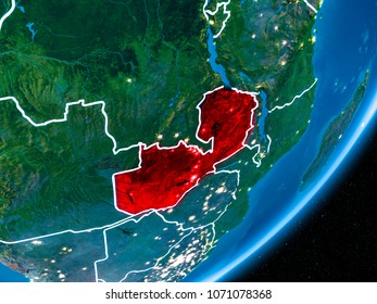 Zambia In Red On Planet Earth At Night With Visible Borderlines And City Lights. 3D Illustration. Elements Of This Image Furnished By NASA.