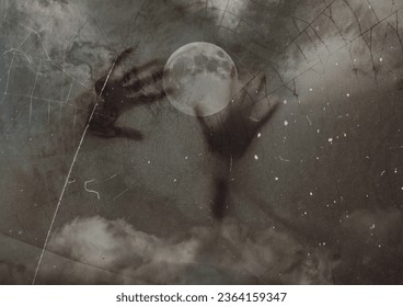 zombie hand, or ghost evil hand, for halloween or scary horror movie background, with moon and nightmare foggy mist grunge bizarre danger feelings - Powered by Shutterstock