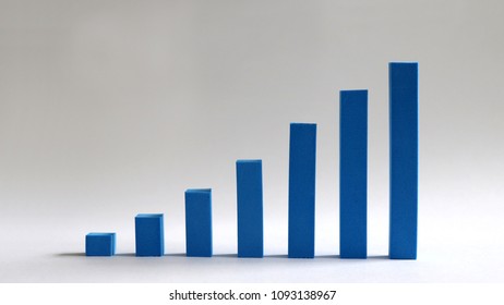 A blue bar graph handmade on a soft background.