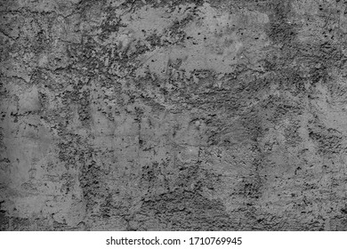 Black white old worn shabby pavement on street large gray slab. Vintage natural cracked texture, damage structure uneven rocky surface.Hard stained travertine, brush pattern of rock wall for 3D design