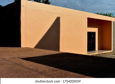 yellow​ building​ structure​ in​ bright​ sunlight​ on​ s​hadow