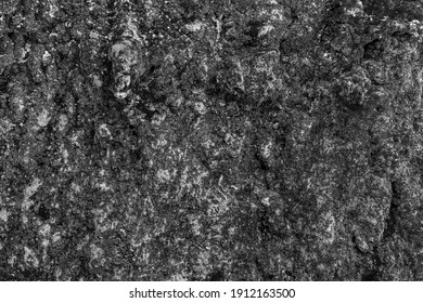 Old ripped wrecking and jagged bumpy quarry facade. Raw pitted ruined grungy ragged grotto rot for 3d rough dirty rustic design. Shabby cracked crumbled battered mud slides of worn layer grunge canyon