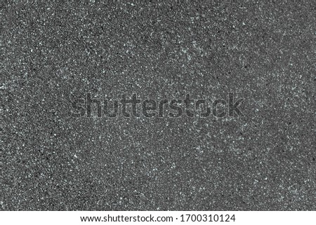 Washed granite gravel, chipped flat little stones. Smooth small marble pebbles for paper web site texture backdrop. Rough natural quartz crumbs on concrete panel. Cement wall border outdoor city patio