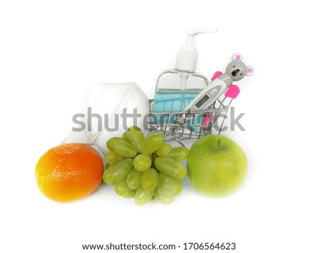 The​ view​s​ alcohol​ gel​ bottle​ and​ mask​ with​ thermometer​ electronic​ and​ fresh​ fruit​ isolated​ on​ white​ background​ use​ for​ protect​ virus​ corona​ and​ bacteria​, covid​ -​19​ concept​