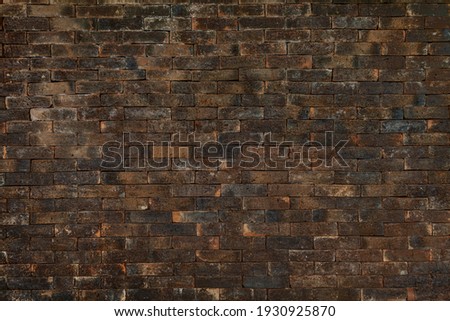 Old grungy rustic dirty dusty brick wall of ancient city. Uneven pitted peeled surface brickwork of cellar worn.Ruined rusty red stiff blocks. Spotted messy ragged holes brickwall for 3D grunge design Stock photo © 