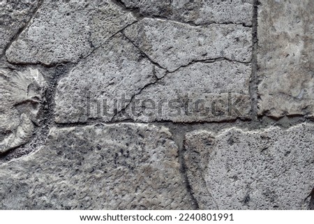Old aged damaged marble bumpy uneven blocks. Trip pitted grunge granite tile cobble. Cragged grimy retro cranny frayed run track. Crannied dirtied shabby smashed gaping rustic big holes for 3d design