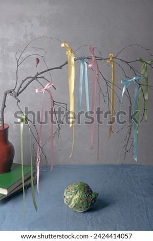 Table with easter decorations pastel ribbons on a birch branch table setting inspiration Easter inspiratiton