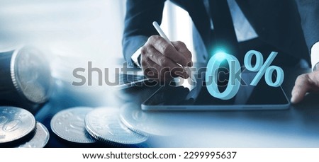 0%, Zero percent commission and interest rate. Double exposure of businessman using digital tablet and coins with zero commission special offer promotion, business strategy