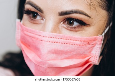 01.02.2020 Kyiv, Ukraine: Portrait Of Female Doctor In Pink Mask Very Close To Eye View