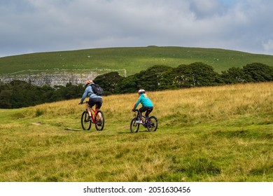 01.09.21 Malham, North Yorkshire, UK A Man And A Young Girl On Mountain Biking At Malham Tarn