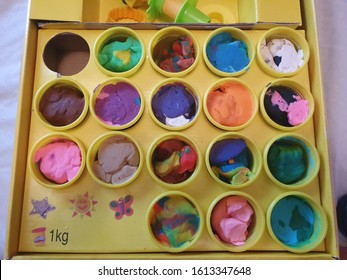 01/10/2020 Portsmouth, Hampshire, UK A Box Filled With Tubs Of Play Doh With The Colours All Mixed Together