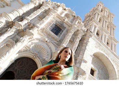 
01/29/2019. A Model Poses With A Traditional Serape In Front Of The Cathedral Of Santiago In The City Of Saltillo, Coahuila, Mexico.