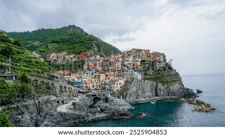 Similar – Image, Stock Photo Manarola is one of the most beautiful villages in Italy. The Cinque Terre is a rugged coastline of the Ligurian Riviera and is made up of five beautiful hilltop villages.