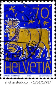 02 09 2020 Divnoe Stavropol Territory Russia postage stamp Switzerland 1996 Children's Drawing Contest The Golden Cow by Daniel Ammann blue background