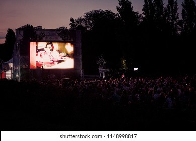 02 August 2018-Bucharest, Romania. People Waiting And Watching In The Public Park Herastrau For The Movie To Start On The Projection Screen Of The Open Air Cinema