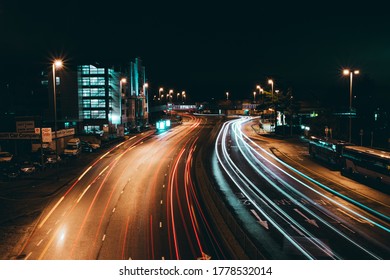 02/04/2020 Portsmouth, Hampshire UK, Car light trails at night passing a block of flats or apartments, showing movement - Shutterstock ID 1778532014