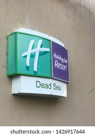 03.06.2019/Amman, Jordan - Holiday Inn Resort Dead Sea Hotel Signboard On The Wall