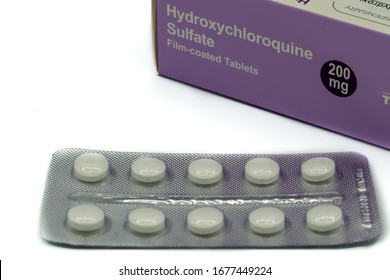 03/19/2020 Portsmouth, Hampshire, UK A Box Of Hydroxychloroquine Tablets With The Tablets In A Packet In Front Also Known As Chloroquine Or Plaquenil