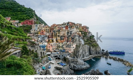 Similar – Image, Stock Photo Manarola is one of the most beautiful villages in Italy. The Cinque Terre is a rugged coastline of the Ligurian Riviera and is made up of five beautiful hilltop villages.