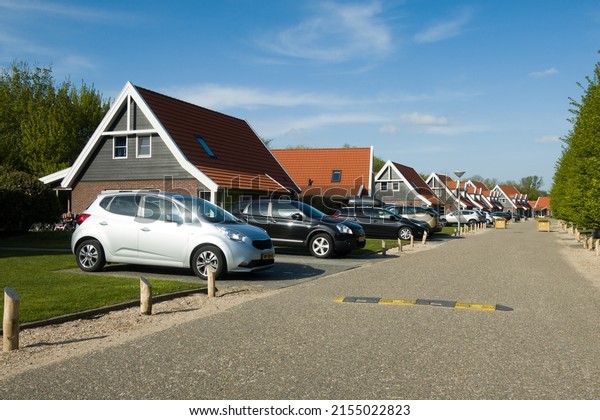 04 26 2022 - Biddinghuizen:\
Due to increasing car ownership, guests\' cars are parked in front\
of the houses in a holiday park in Flevoland, the\
Netherlands.