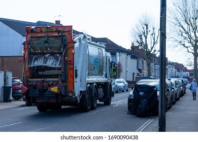 04/01/2020 Portsmouth, Hampshire, UK A Rubbish Collection Lorry Or Garbage Truck Driving Down An English Street