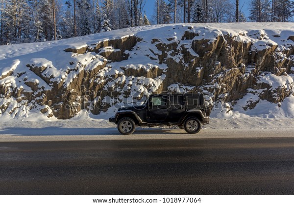 04.02.2018. Karelia, Russia.\
Jeep Wrangler on the road. The Jeep Wrangler is an SUV produced by\
Chrysler
