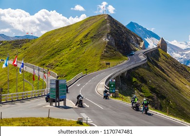 04.08.2018 . Grossglockner High Alpine Road . Austria. Tyrol. Europe. People on cars and motorcycles travel on mountain serpentine. Tourist destination, tourist attraction. Concept of autotourism.