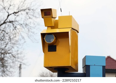 04.10.2023 wroclaw, poland, The yellow speed camera takes pictures of traffic violations for car drivers.