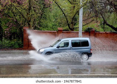 05.01.2021 wroclaw, poland, The car falls into a pool of water on the road, causing a splash.