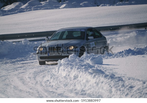 05-02-2021 RIga,\
Latvia. extreme driving, the car is moving rapidly over the smooth\
snow and creates a spray of\
snow