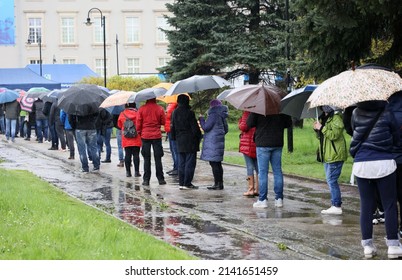 05.03.2021 Wroclaw, Poland, People Under Umbrellas Are Waiting In Line To The Mobile Vaccination Point In Wrocław